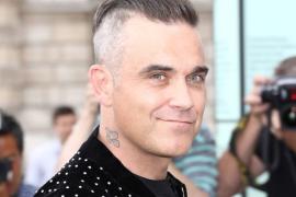 Robbie Williams revela que por poco muere por una dieta de pescado