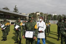 Ceremonia de Entrega de Condecoración al Mérito Militar, Distinción de Desempeño por el Plan DN-III-E y Distintivo Covid-19, realizada en las Instalaciones del estadio de Fútbol SEDENA, CDMX